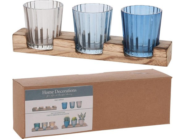 Theelichthouderset glas op houten plank